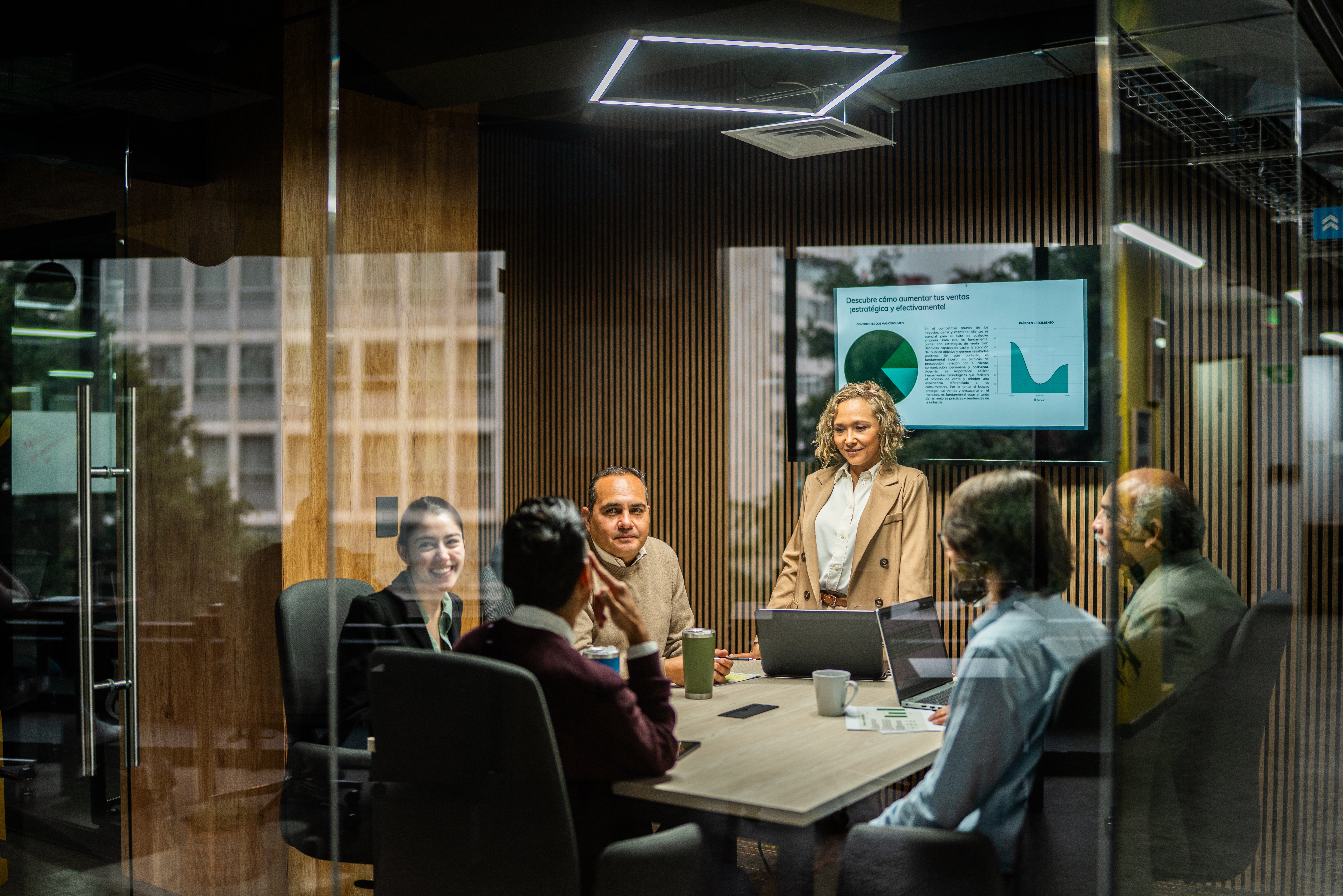 A group of team members sitting together in an office setting to discuss workforce challenges.